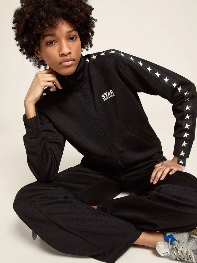 Pantaloni da jogging da donna neri con stelle bianche sui lati