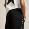 Pantaloni da jogging da donna neri con stelle bianche sui lati