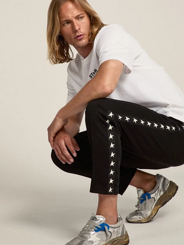 Pantaloni da jogging da uomo neri con stelle bianche sui lati