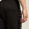 Pantaloni da jogging da uomo neri con stelle bianche sui lati