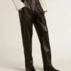 Pantaloni da jogging neri in pelle nappa con cerniera sul fondo