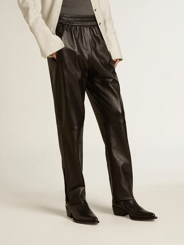 Pantaloni da jogging neri in pelle nappa con cerniera sul fondo
