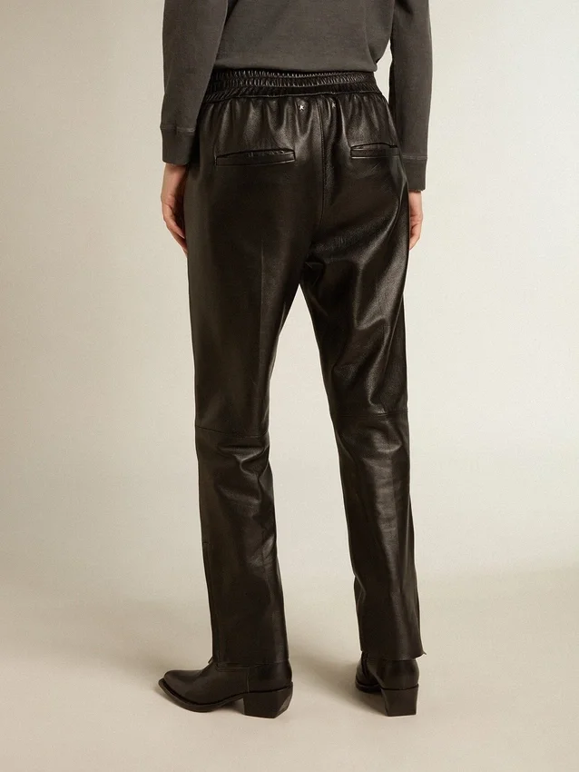 Pantaloni da jogging neri in pelle nappa con cerniera sul fondo