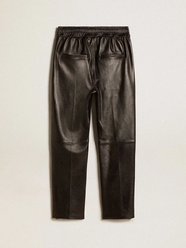 Pantaloni da jogging neri in pelle nappa con cerniera sul fondo