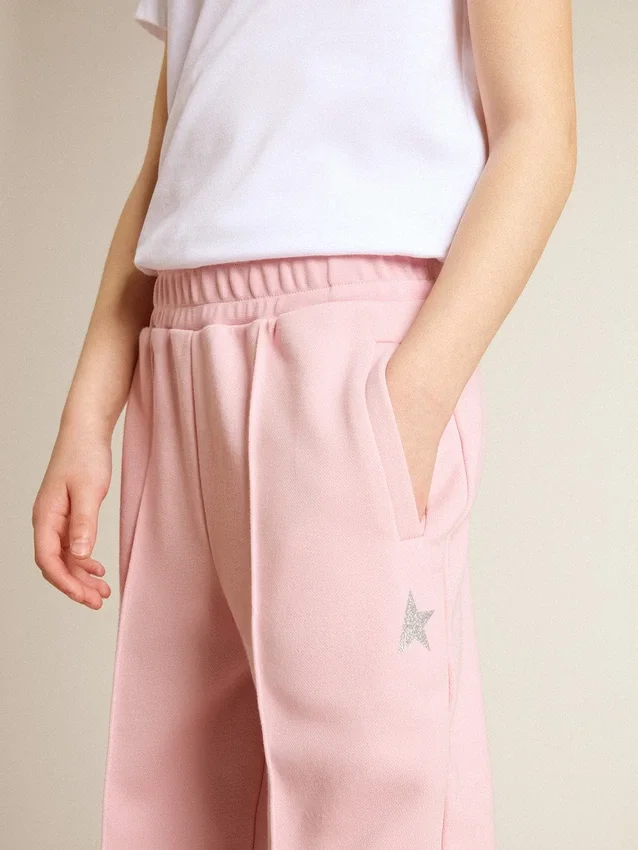 Pantaloni da jogging rosa con stella glitterata sul davanti