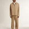 Pantaloni da uomo beige con toppe