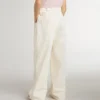 Pantaloni larghi a costine color crema per bambine con ricami