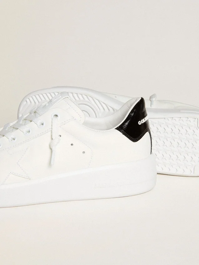 Purestar da donna con stella in pelle e linguetta sul tallone in vernice nera