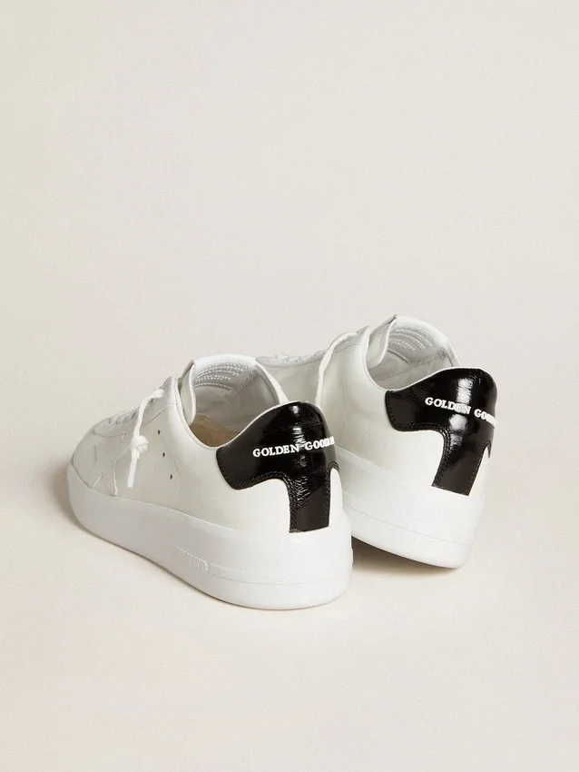 Purestar da donna con stella in pelle e linguetta sul tallone in vernice nera