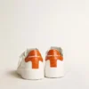 Purestar da uomo con stella in pelle bianca e linguetta sul tallone arancione