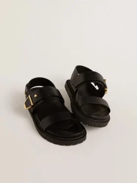Sandalo da donna Lucy in pelle nera lucida con fibbia in metallo dorato