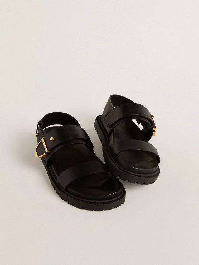 Sandalo da donna Lucy in pelle nera lucida con fibbia in metallo dorato