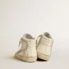 Slide con stella in pelle metallizzata argento e inserto in pelle con stelle