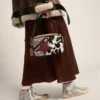 Slide da donna con tomaia in pelle laminata e glitter argento