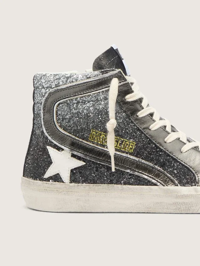 Slide da donna in nero e glitter argento con stella in pelle e riflessi metallici
