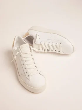 Sneakers Purestar da donna con linguetta sul tallone color oro