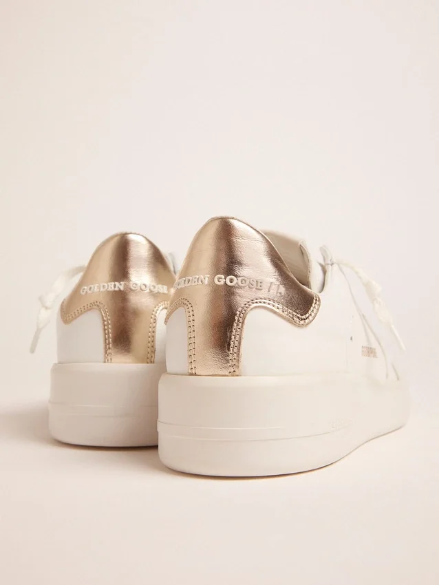 Sneakers Purestar da donna con linguetta sul tallone color oro