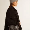 Star Bag in pelle nera lucida con stella tono su tono