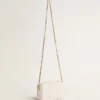 Star Bag Mini in pelle bianco burro con stella tono su tono