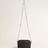 Star Bag Mini in pelle nera con stella tono su tono