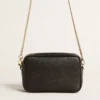 Star Bag Mini in pelle nera con stella tono su tono