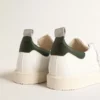 Starter a base biologica con linguetta sul tallone in pelle verde