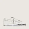 Super-Star da donna con bordo argentato scintillante e scritta con borchie metalliche