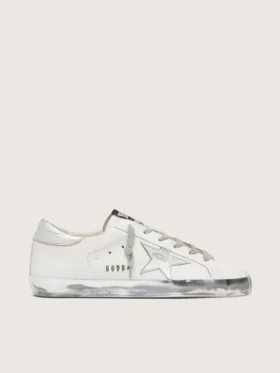 Super-Star da donna con bordo argentato scintillante e scritta con borchie metalliche