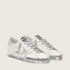 Super-Star da donna con bordo argentato scintillante e scritta con borchie metalliche