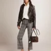 Super-Star da donna con linguetta argentata sul tallone e scritta con borchie metalliche