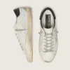 Super-Star da donna con linguetta sul tallone nera e scritta con borchie metalliche