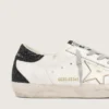 Super-Star da donna con stella dorata e linguetta sul tallone con glitter neri