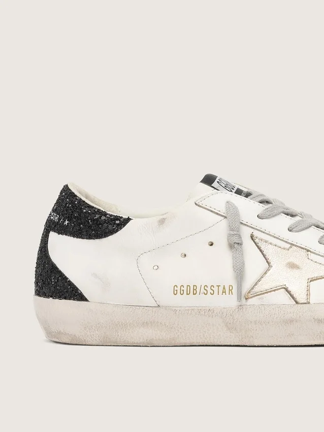 Super-Star da donna con stella dorata e linguetta sul tallone con glitter neri