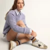 Super-Star da donna con stella glitterata nera e linguetta sul tacco rosa