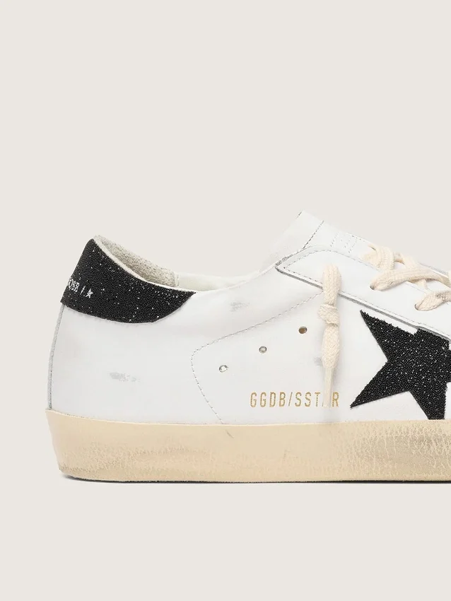 Super-Star da donna con stella in cristalli Swarovski neri e linguetta sul tallone