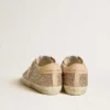 Super-Star da donna in glitter argento con stella in pelle e linguetta sul tallone