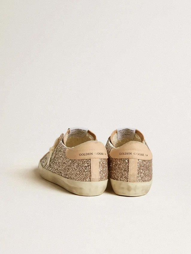 Super-Star da donna in glitter argento con stella in pelle e linguetta sul tallone