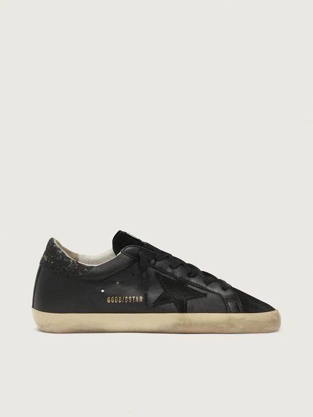 Super-Star da donna in nappa nera con stella nera e linguetta sul tallone glitterata