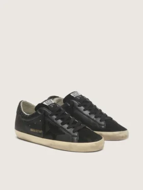Super-Star da donna in nappa nera con stella nera e linguetta sul tallone glitterata