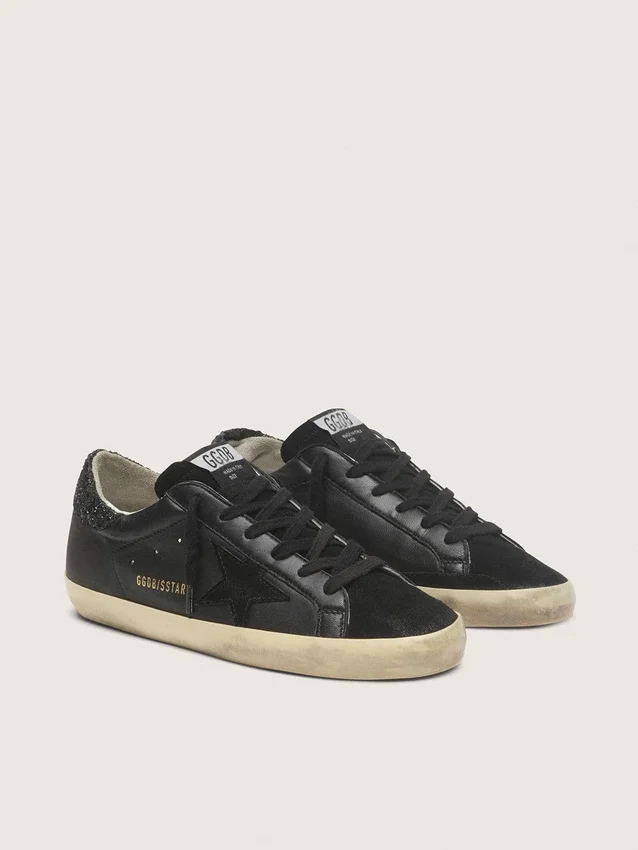 Super-Star da donna in nappa nera con stella nera e linguetta sul tallone glitterata