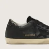 Super-Star da donna in nappa nera con stella nera e linguetta sul tallone glitterata