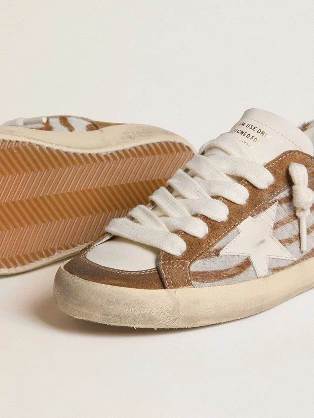 Super-Star da donna in pelle di cavallino con stampa zebrata, stella in pelle e inserti in pelle scamosciata marrone