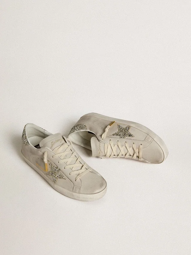 Super-Star da donna in pelle nappa avorio con stella glitterata platino e linguetta sul tallone