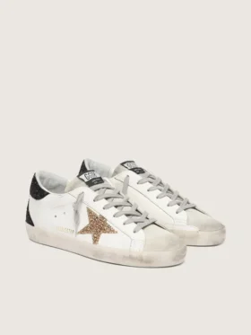 Super-Star da donna in pelle nappa con stella glitterata dorata e linguetta sul tallone nera glitterata