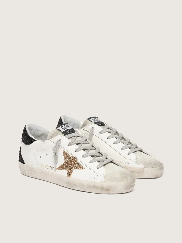 Super-Star da donna in pelle nappa con stella glitterata dorata e linguetta sul tallone nera glitterata