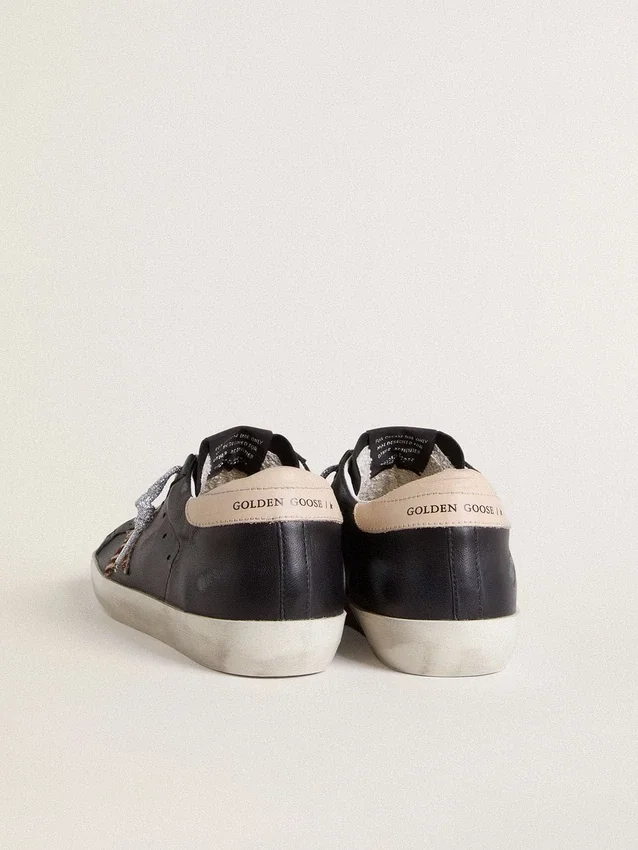 Super-Star da donna in pelle nappa nera con stella in pelle di pony con stampa zebrata e linguetta sul tallone in pelle beige