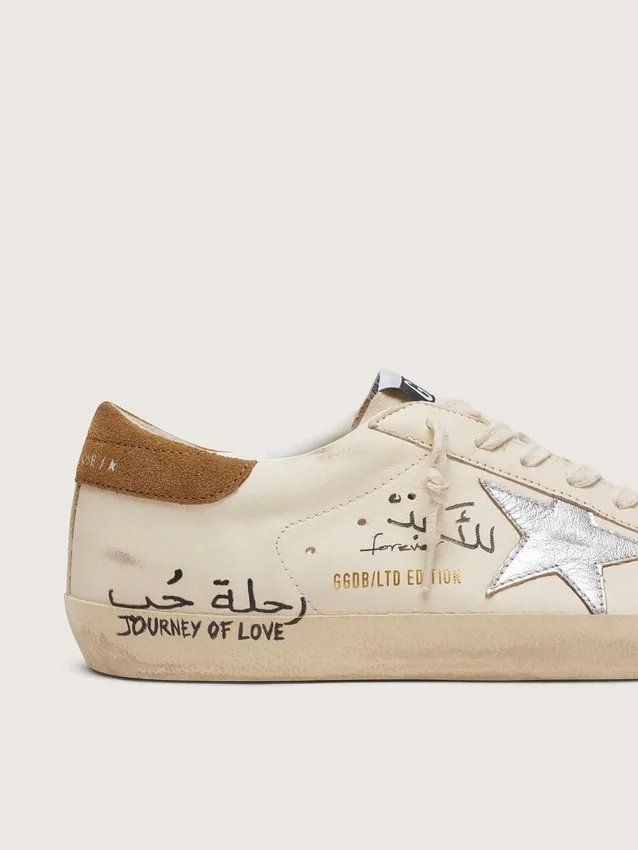 Super-Star da uomo in nappa con stella argentata metallizzata e scritte su tutta la superficie