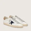 Super-Star da uomo in pelle bianca con stella in tela blu notte e linguetta sul tallone in pelle color tabacco
