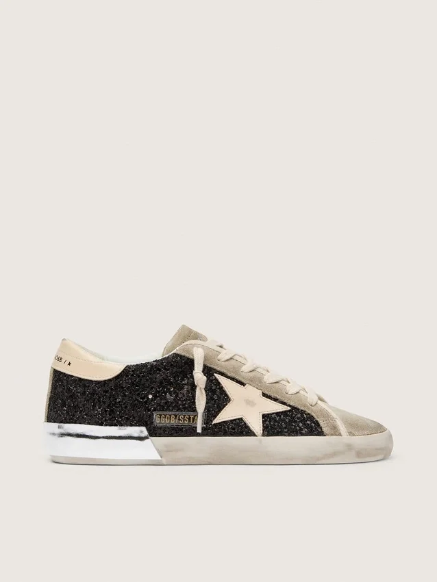 Super-Star in glitter nero con stella color crema e inserti in pelle scamosciata