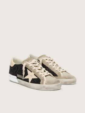 Super-Star in glitter nero con stella color crema e inserti in pelle scamosciata